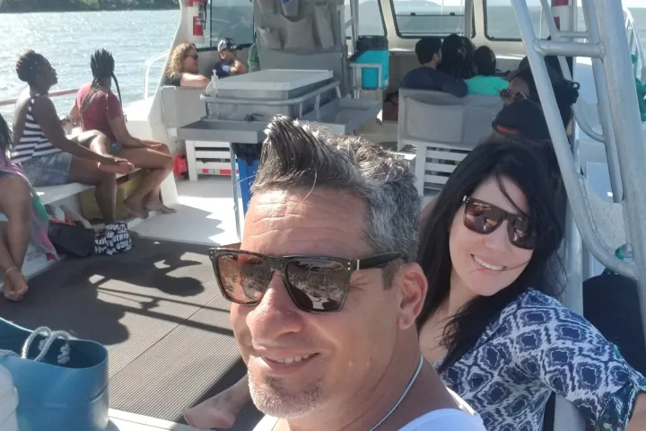 a group of people standing around a plane