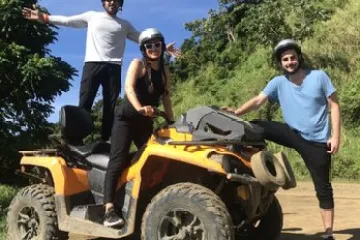 a group of people riding on the back of a truck
