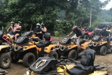 a group of people riding on the back of a motorcycle