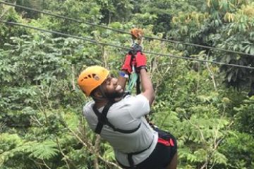a person standing next to a tree