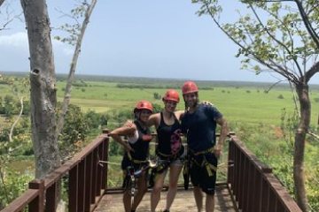 a group of people walking on a bridge