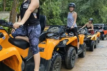 a group of people sitting on a motorcycle