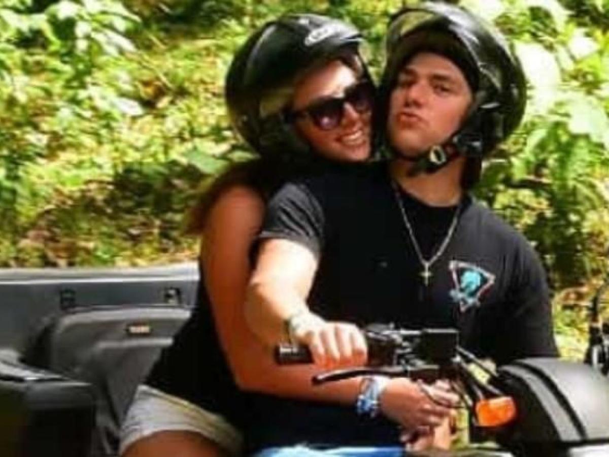 a person wearing a helmet riding a motorcycle