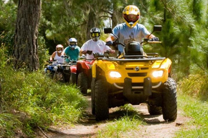 a man riding on an atv