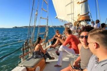 a group of people on a boat in the water
