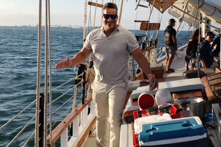 a person standing on a boat in the water