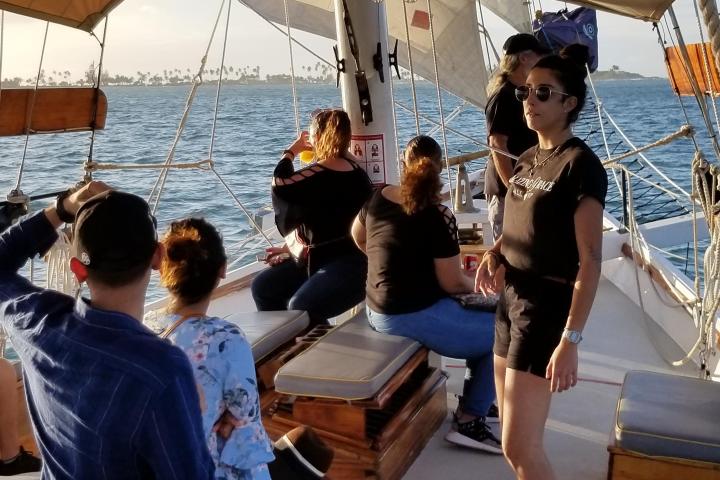 a group of people on a boat in the water
