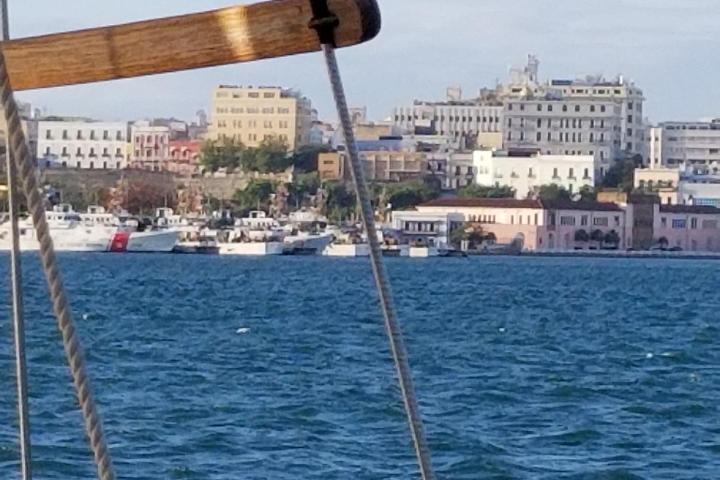 a large body of water with a city in the background