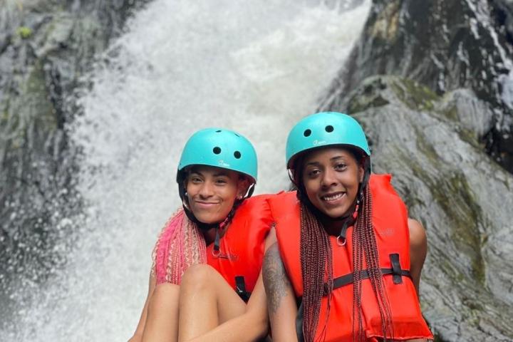 a person sitting on a raft in the water