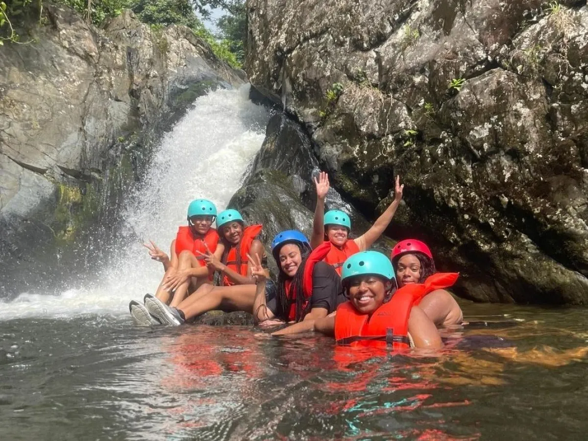 a group of people on a raft in a body of water