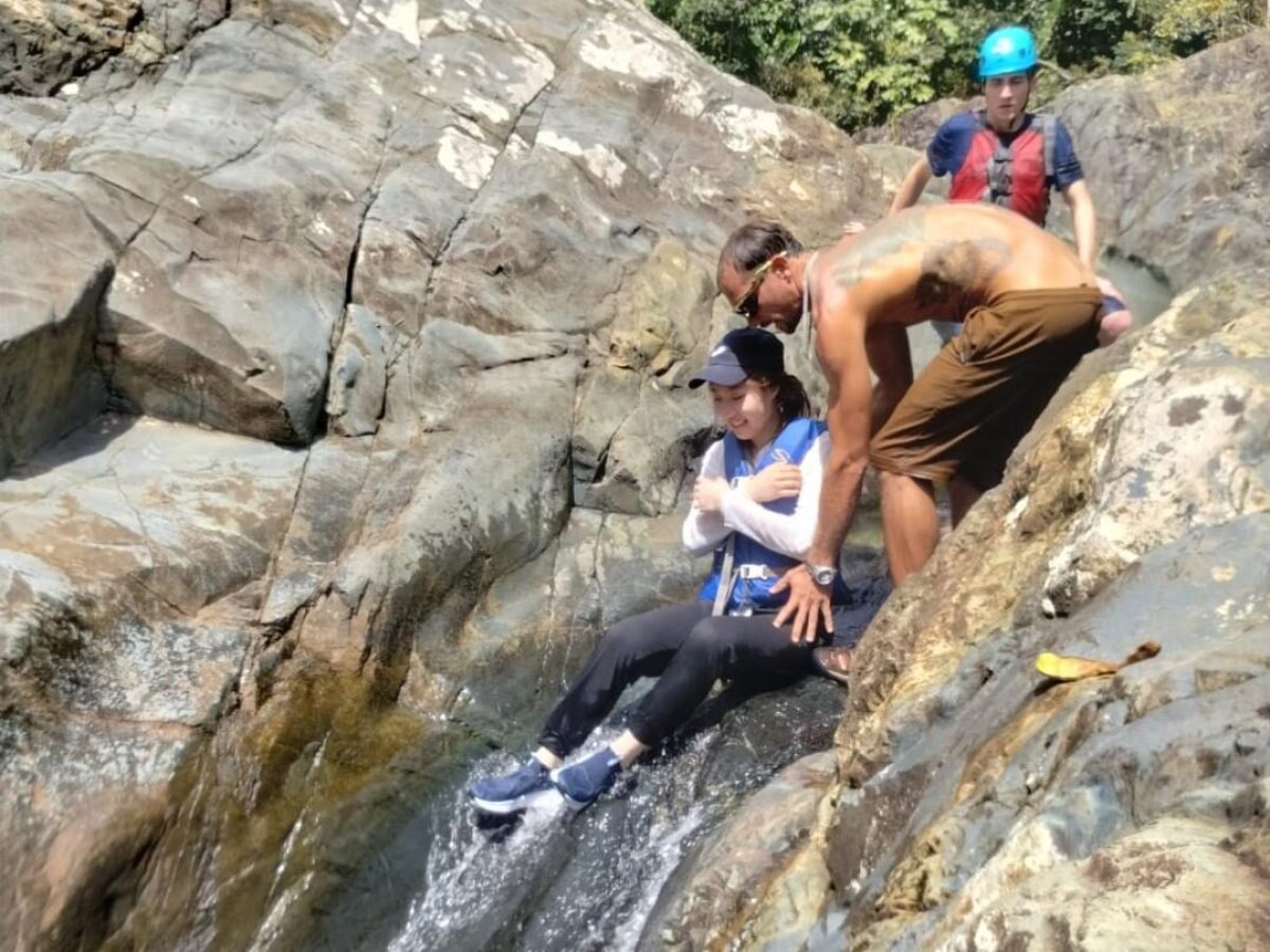 a man riding on top of a rock