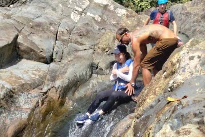 a man riding on top of a rock