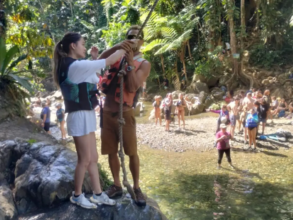 a group of people standing on a rock