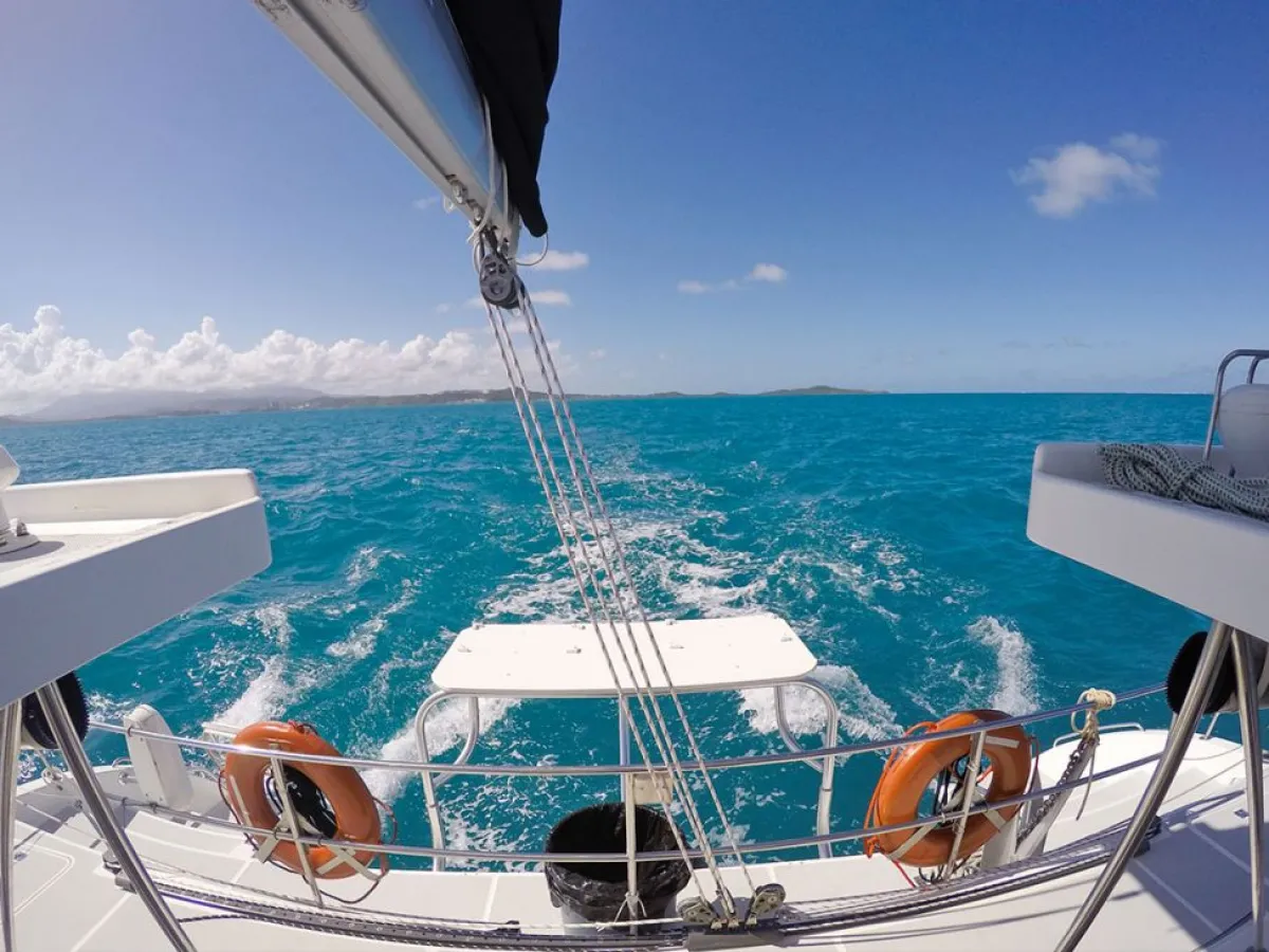a boat sitting next to a body of water