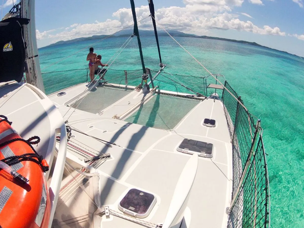a close up of a boat next to a body of water