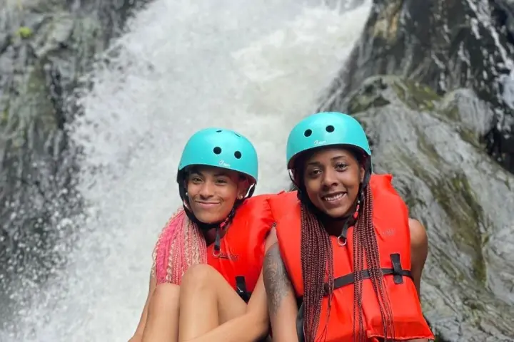 a person sitting on a raft in the water