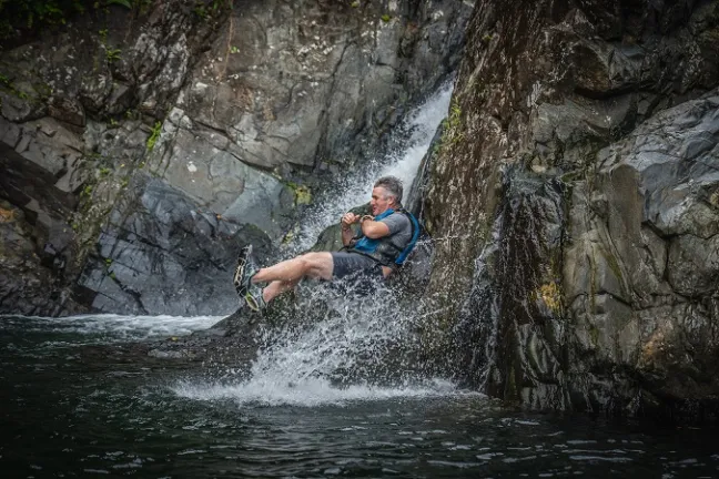 a man riding on top of a rock