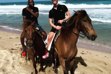 a couple of people on a beach
