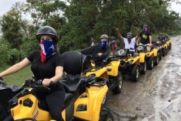 a group of people riding on the back of a motorcycle