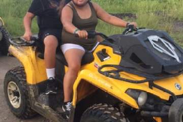 a person riding a motorcycle posing for the camera