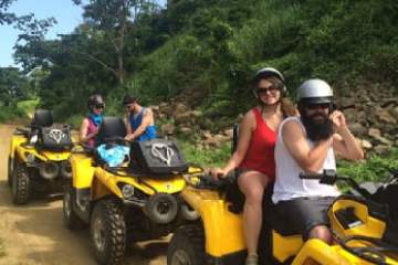 a motorcycle parked on the side of a dirt road