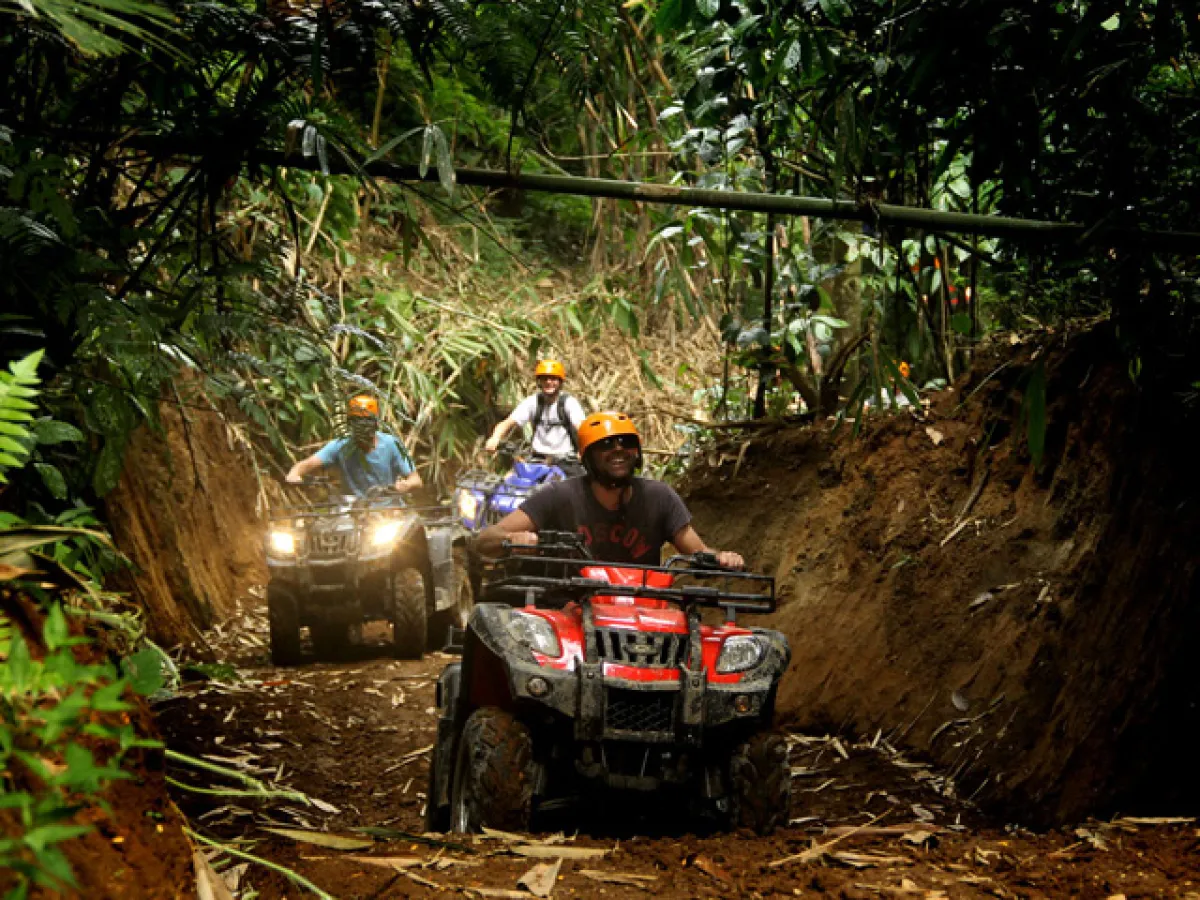 a truck driving down a dirt road