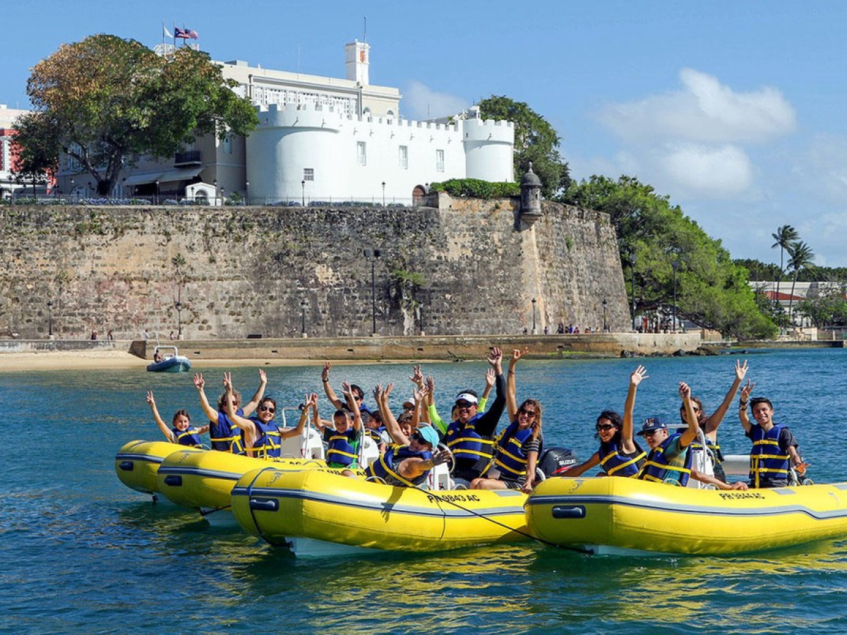 a group of people on a boat in the water
