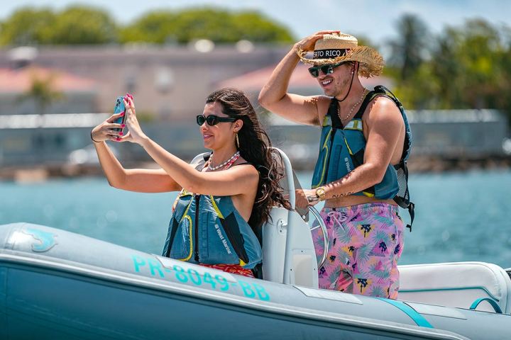 a woman riding on the back of a boat