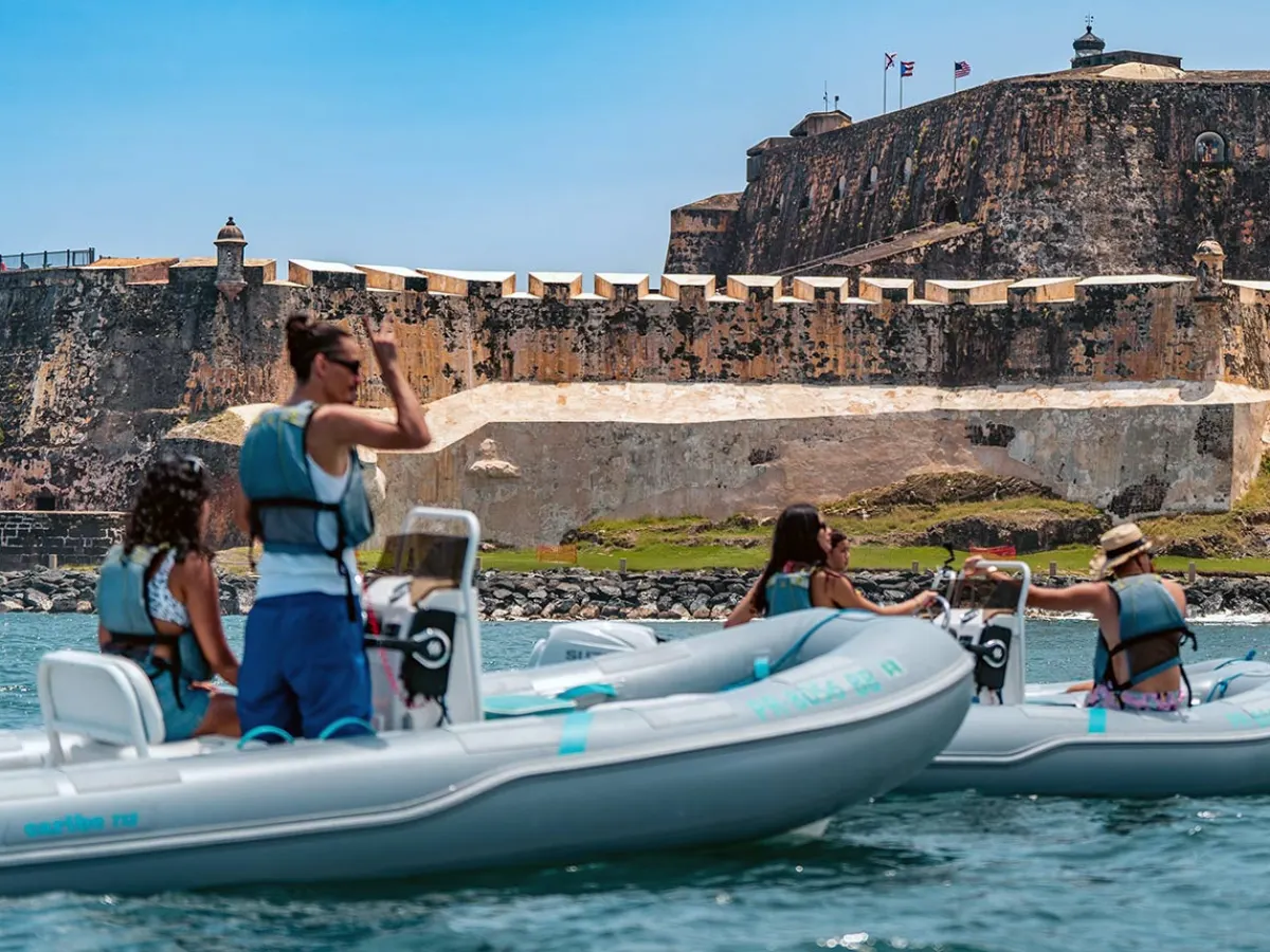 a group of people on a boat in the water