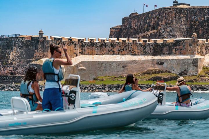 a group of people on a boat in the water
