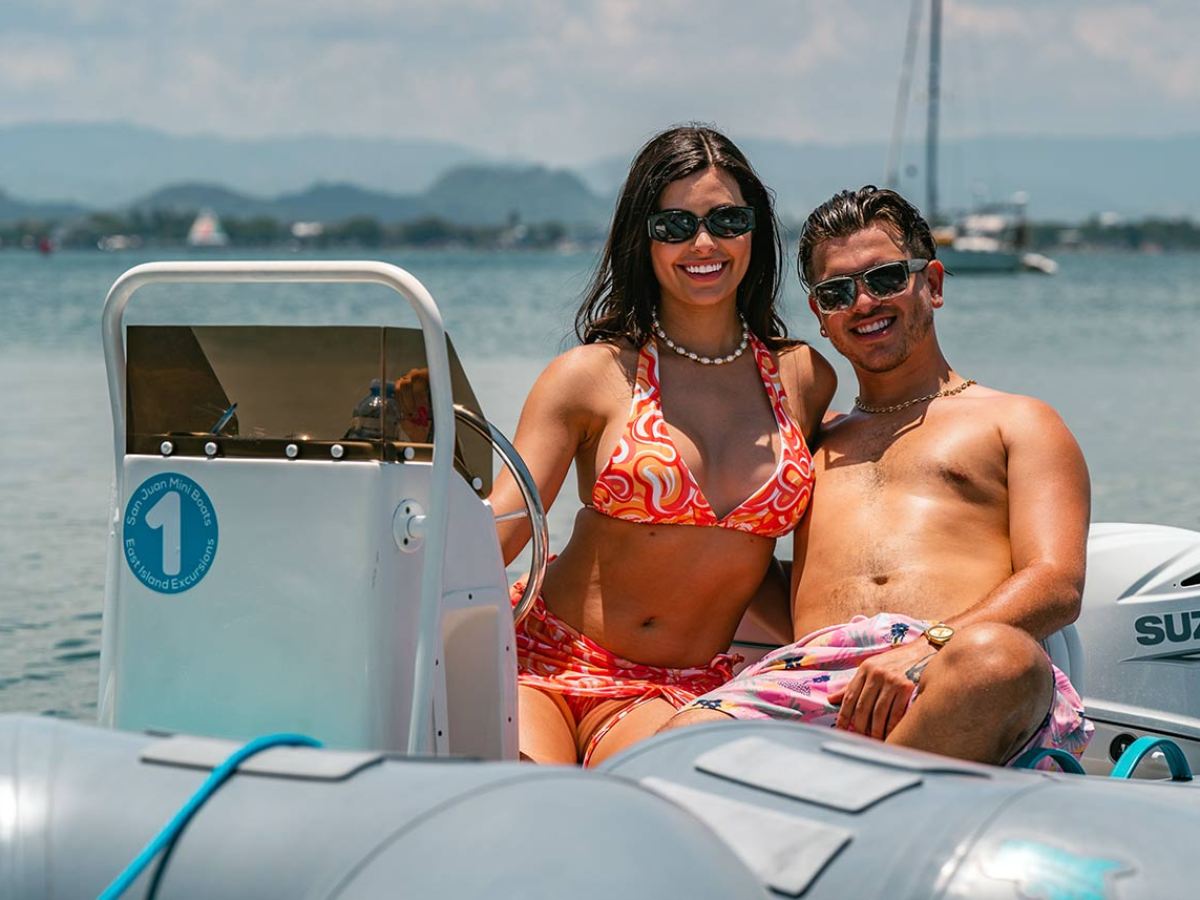 a man sitting on a boat in the water