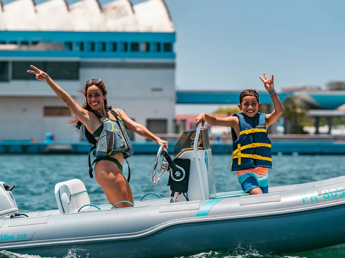 a group of people riding on the back of a boat