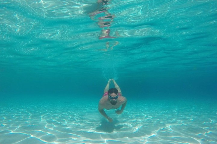 a person swimming in a pool of water