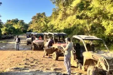 a group of people on a dirt road