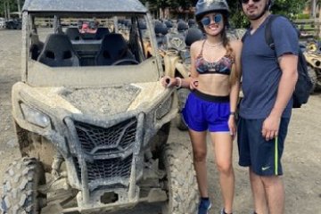 a group of people standing in front of a truck