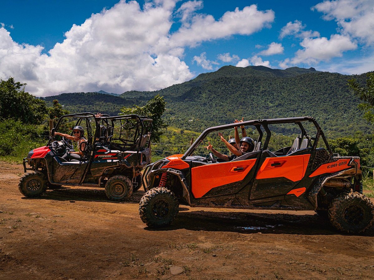 a truck driving down a dirt road