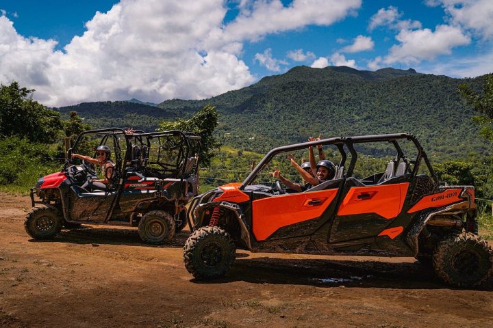 a truck driving down a dirt road