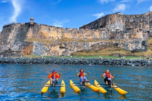 a group of people on a raft in the water