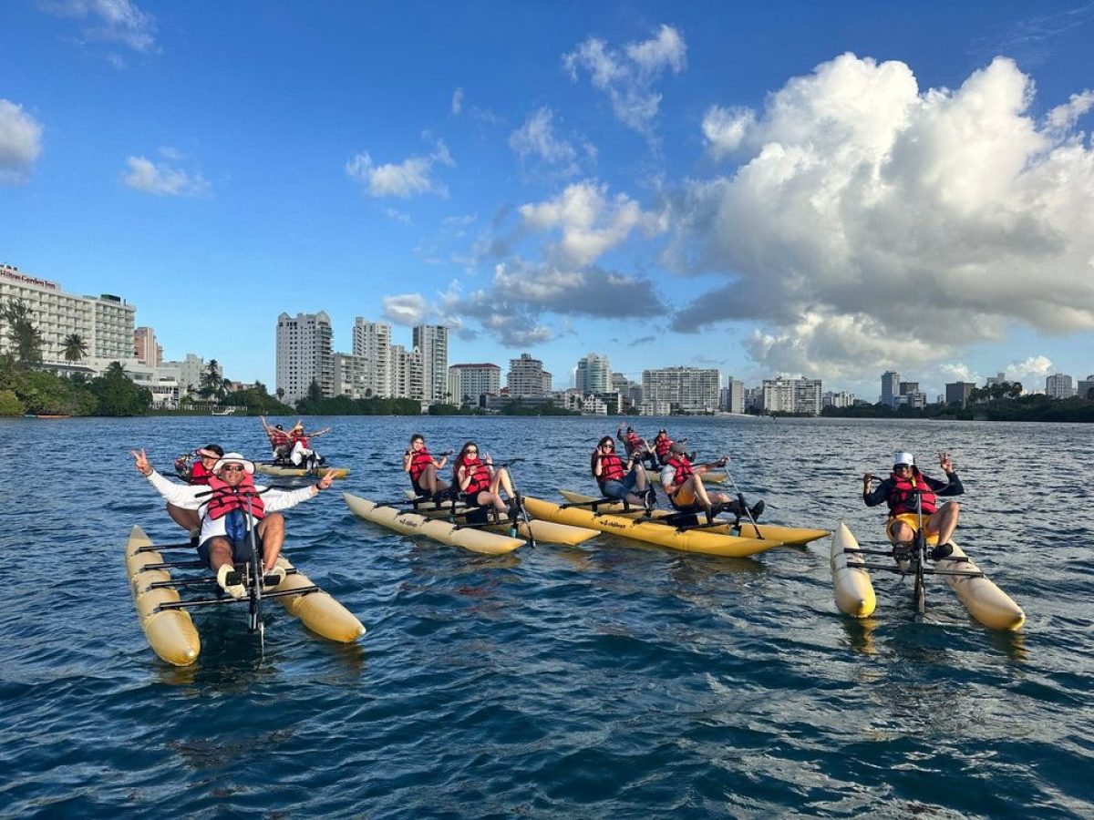 a group of people in a boat on a body of water