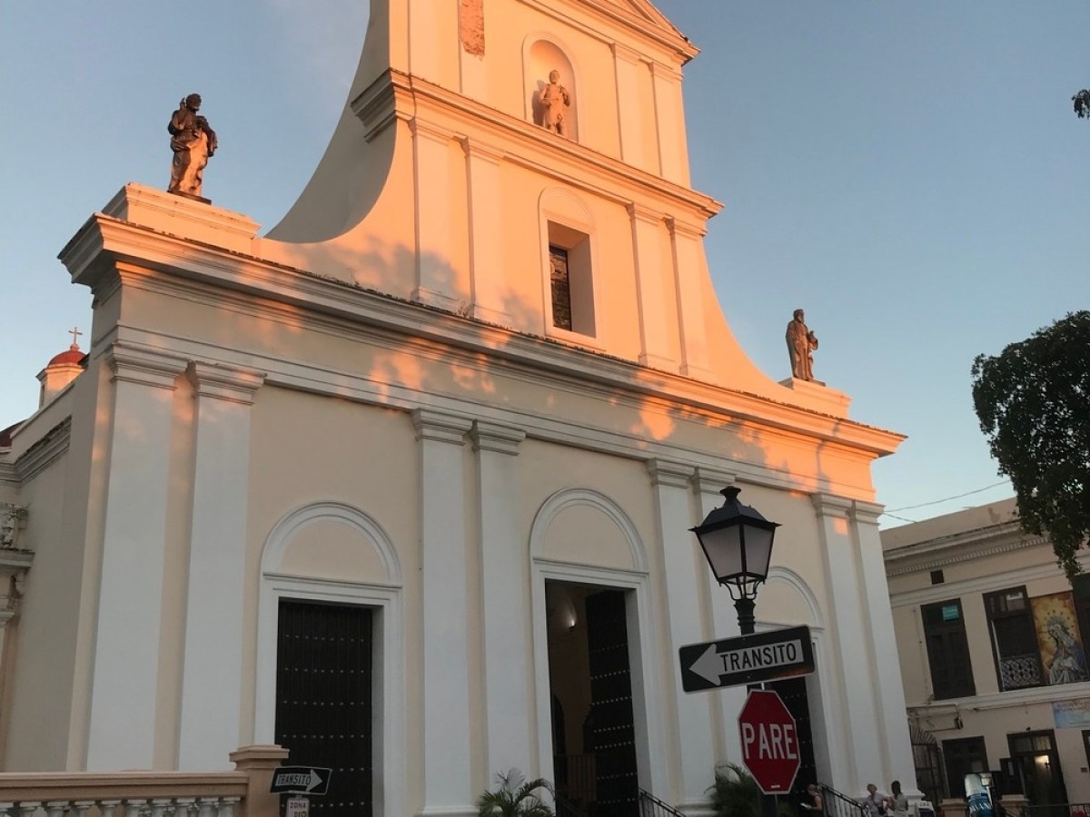 a clock tower in front of a building