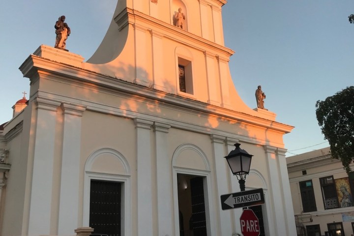 a clock tower in front of a building