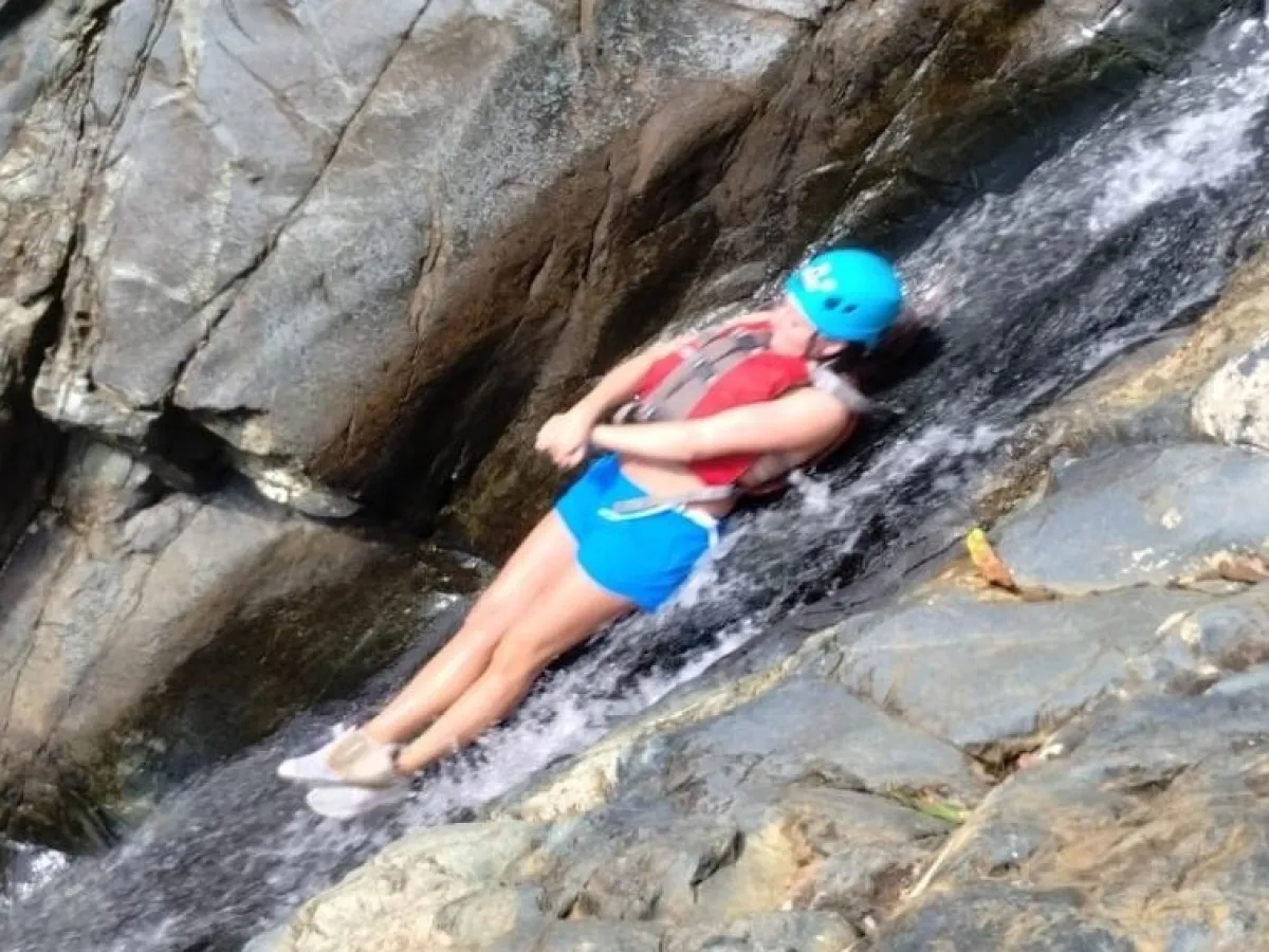 a person sitting on a rock