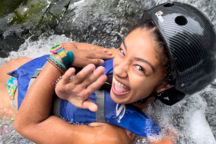 a young girl in a pool of water
