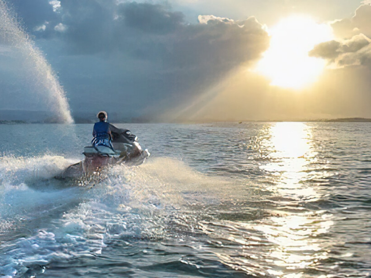 a man riding a wave on a surfboard in the water
