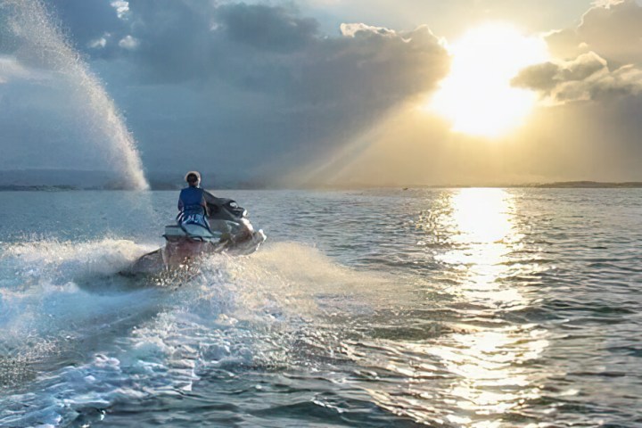 a man riding a wave on a surfboard in the water