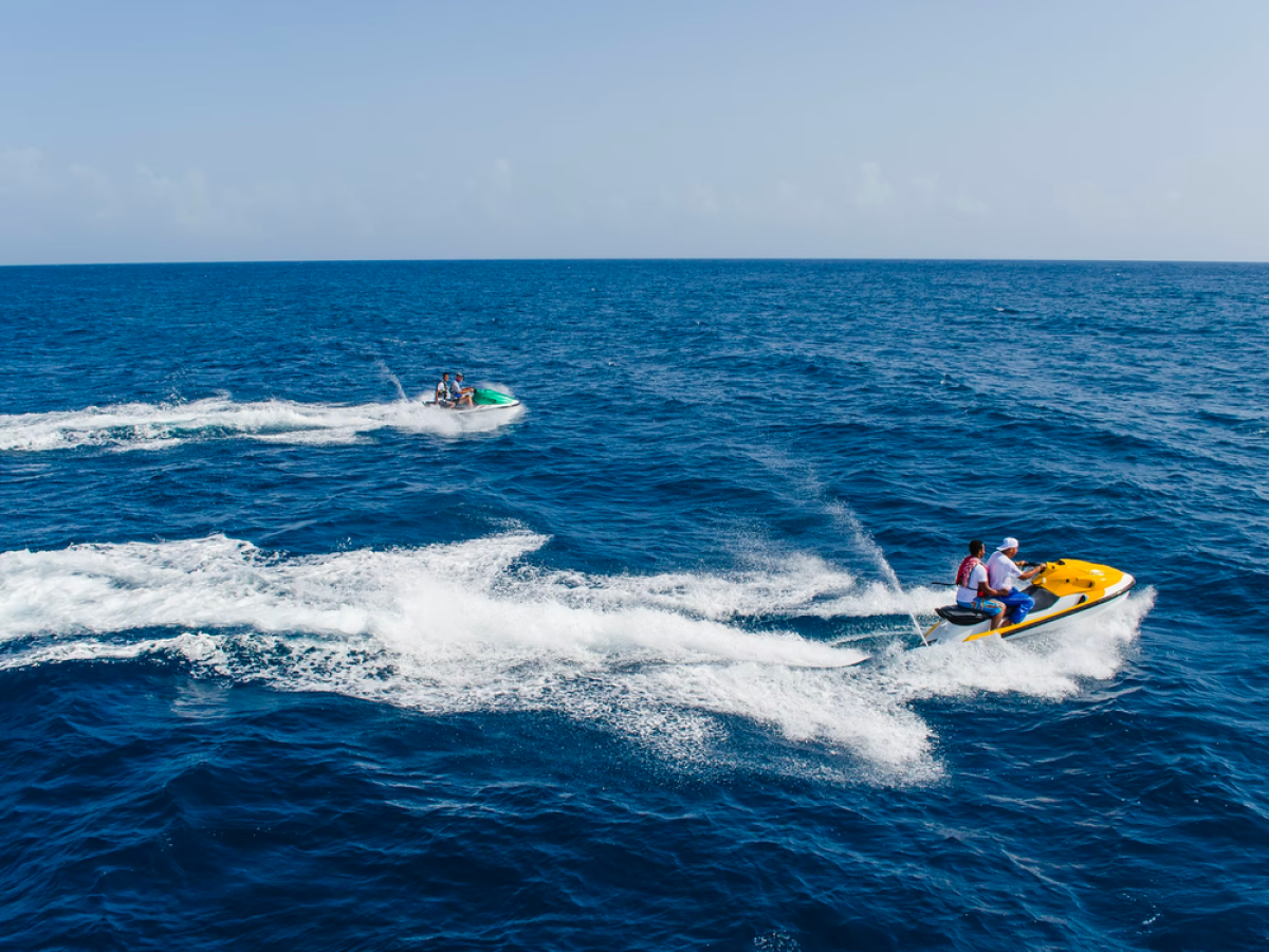 a man riding a wave on top of a body of water
