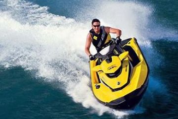 a man riding a wave on top of a body of water