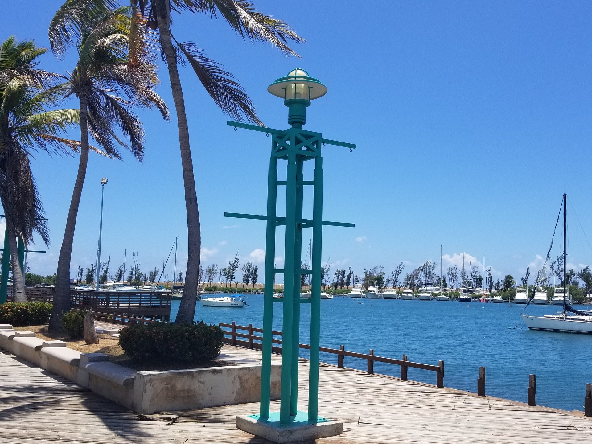 a boat is docked next to a body of water