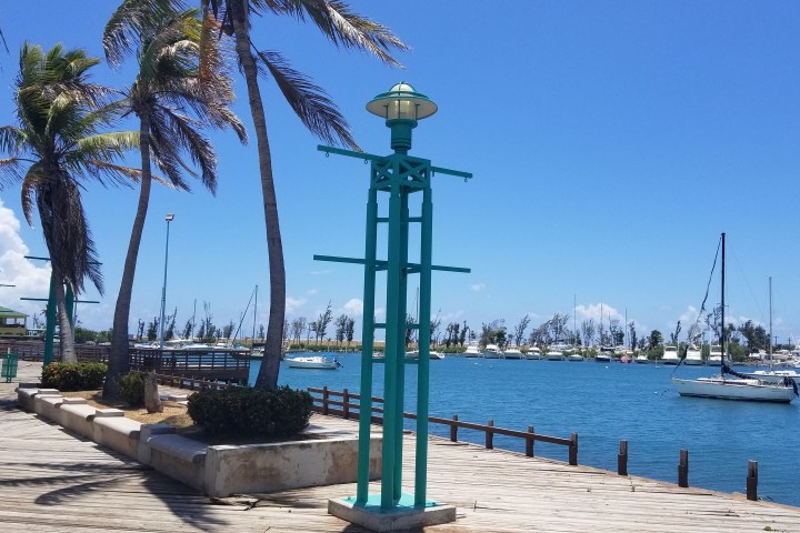 a boat is docked next to a body of water