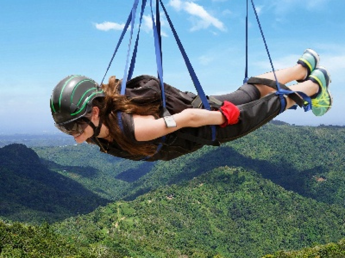 a man holding a kite in a body of water